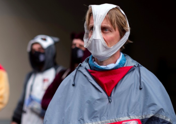 man wearing underpants as face mask