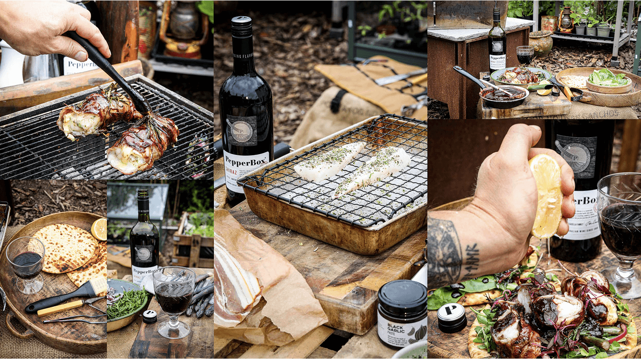 Outside food preparation with meat on BBQ and PepperBox red wind bottle